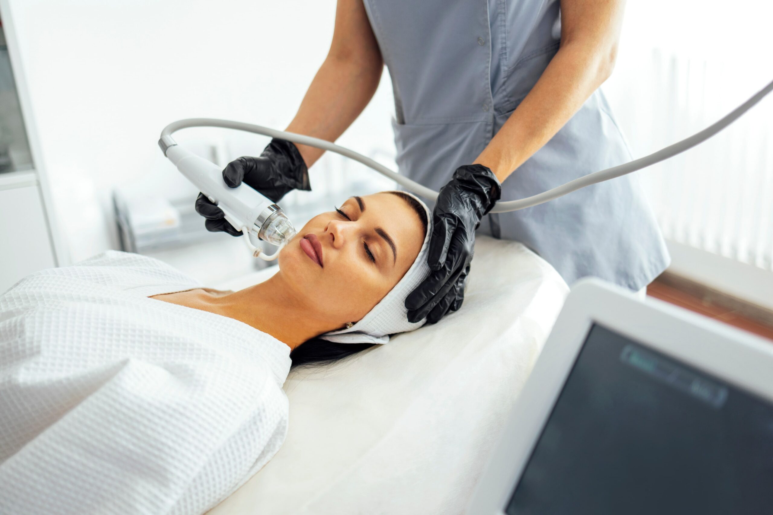 Young woman getting Medical-Grade-Peel Treatment in New York, NY Re:forma