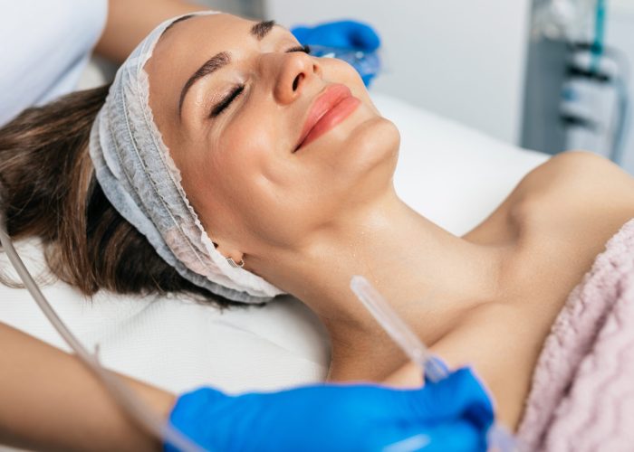 A beautiful woman getting skin rejuvenation treatment at a beauty salon by Re:forma in New York, NY